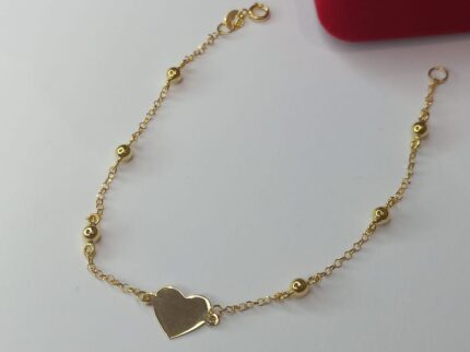 PULSEIRA FEMININA DE CORAÇÃO, MALHA ELOS PORTUGUÊS, COM SEIS ESFERAS OCADAS DE TRÊS MILÍMETROS, 18CM DE COMPRIMENTO, EM OURO 18K